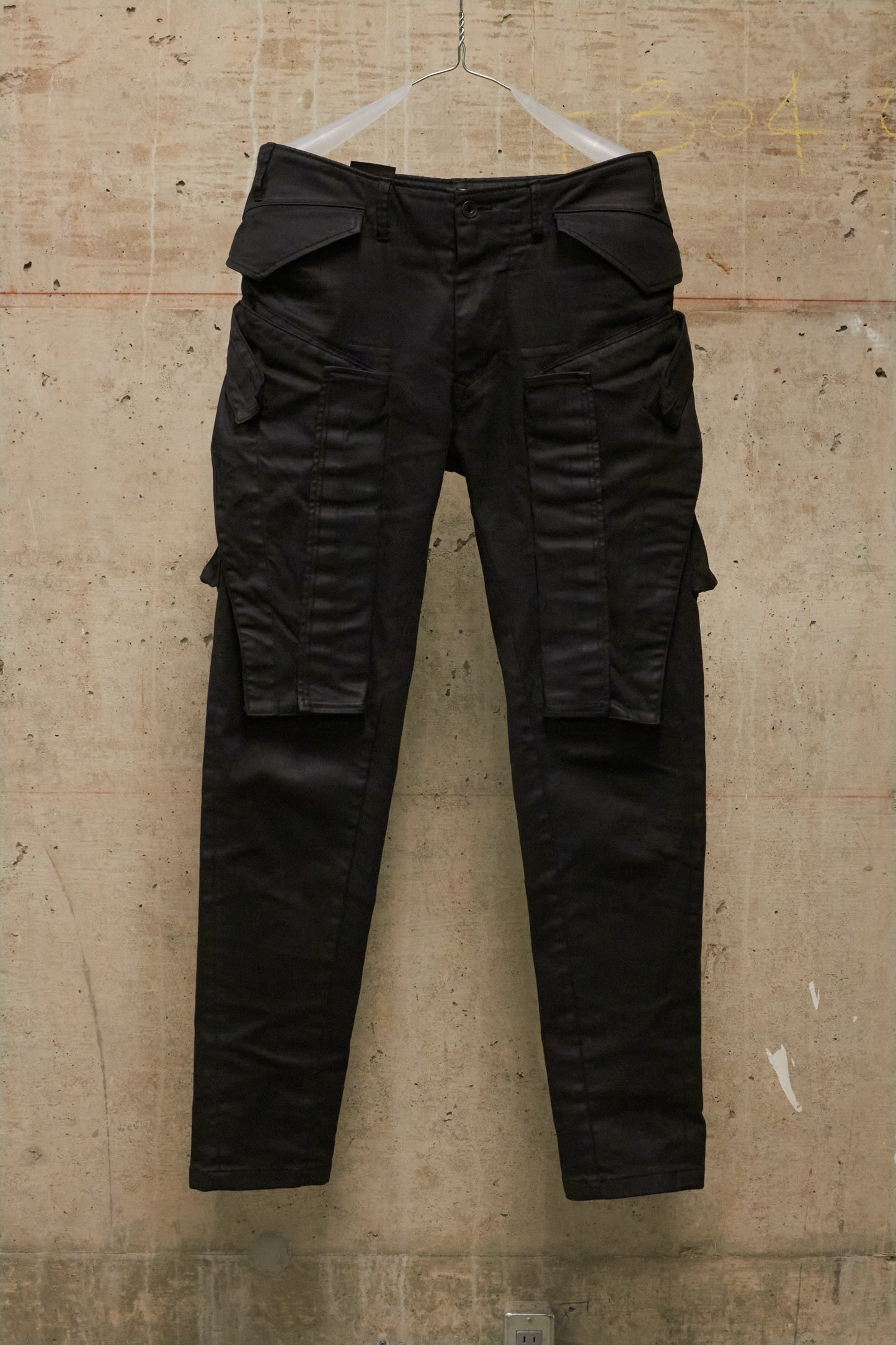 Julius_7 AW16-17 "beast;" WaxCoated Vertical Gas-Mask Cargo Denim