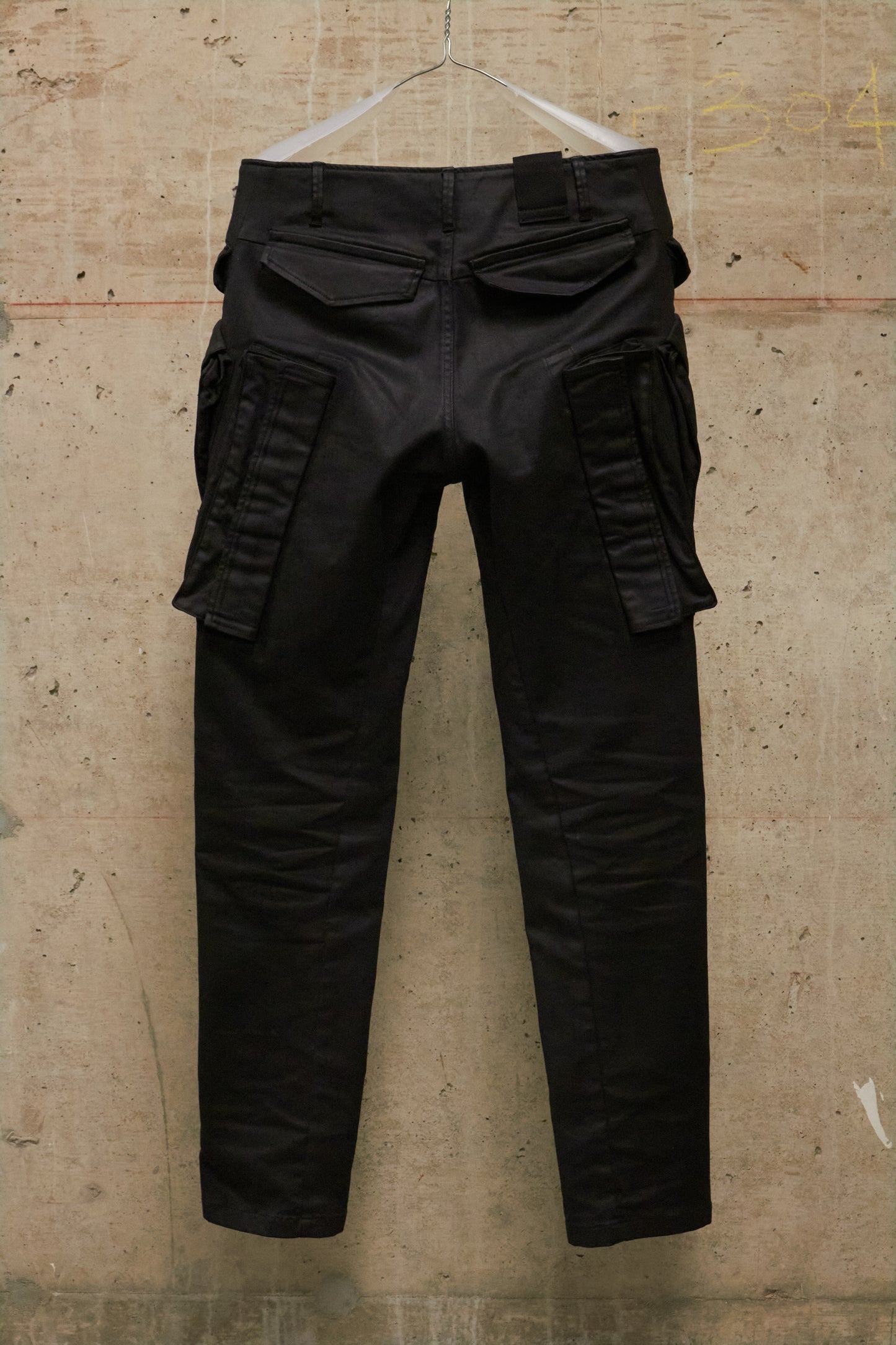 Julius_7 AW16-17 "beast;" WaxCoated Vertical Gas-Mask Cargo Denim