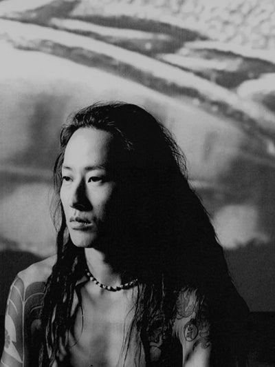 Lui Onozaki portrait in black and white — designer known for tribal punk and leather-inspired clothing