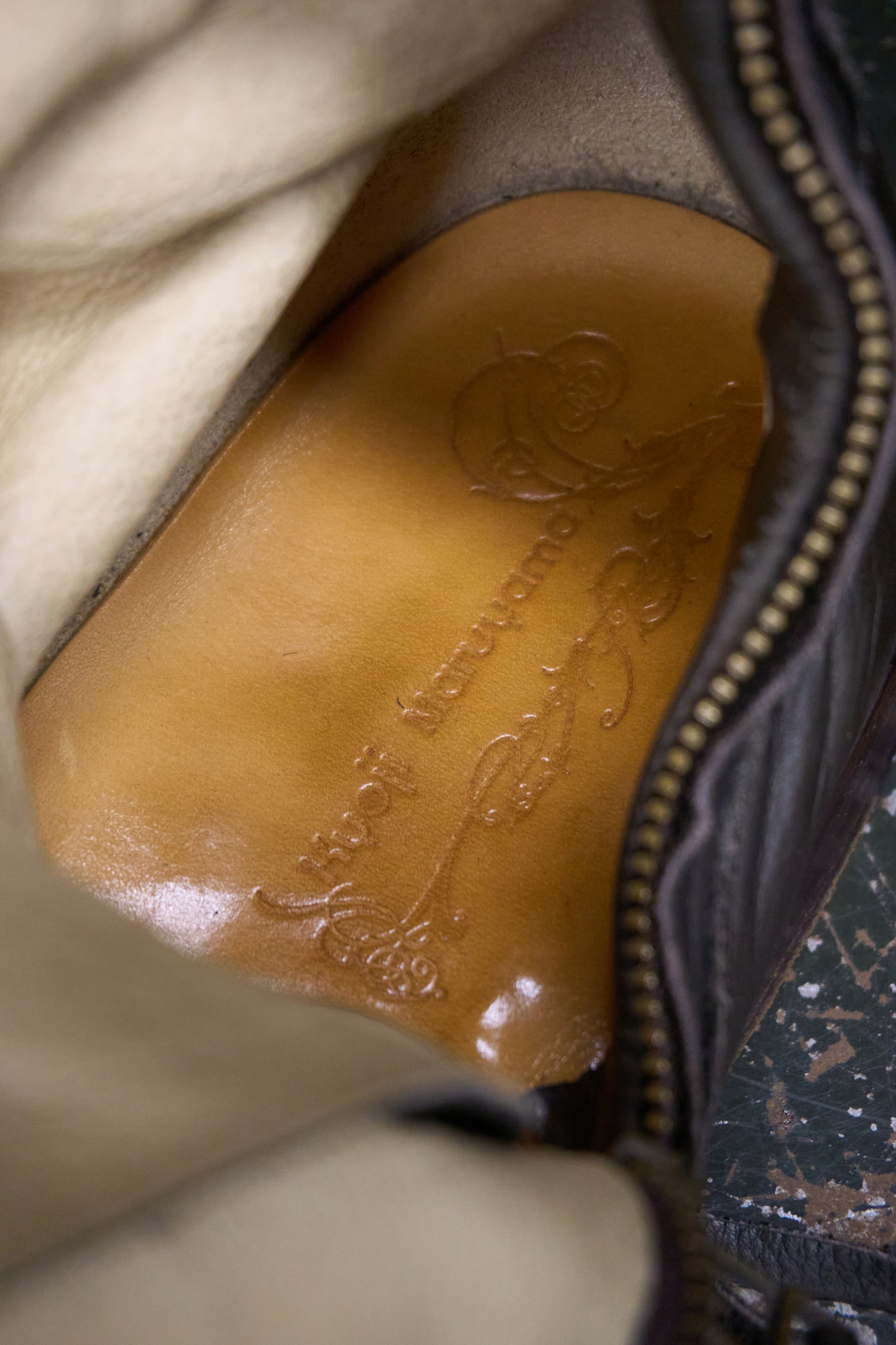Close-up of a leather patch with branding on a garment.