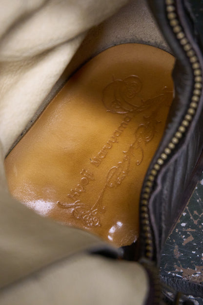 Close-up of a leather patch with branding on a garment.