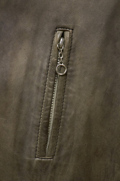 Close-up of a zipper on a brown leather jacket