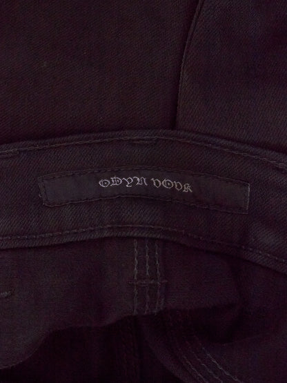 Close-up of a dark fabric with a brand label on a dark background