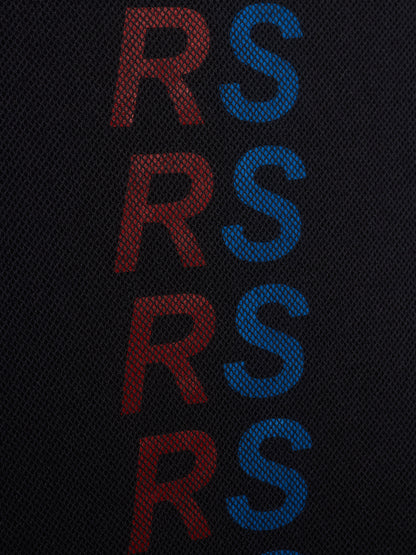 Close-up of a black mesh fabric with a vertical repeating pattern of the letters 'RS' in alternating red and blue.