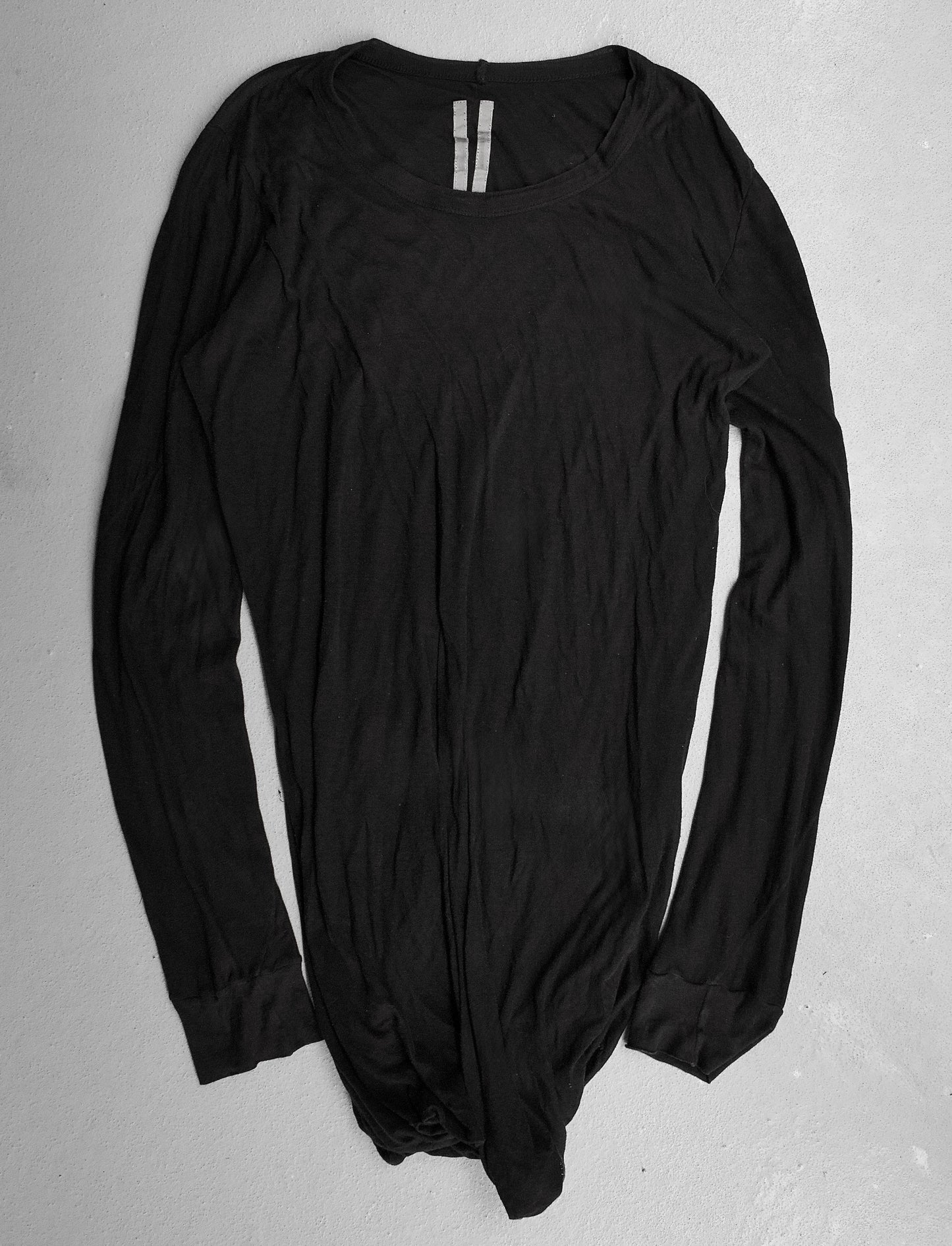 Black long-sleeve bodysuit on a gray background