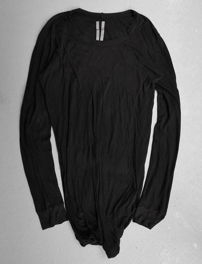 Black long-sleeve bodysuit on a gray background