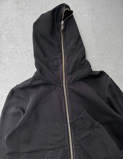 Black hooded jacket with a zipper on a gray background