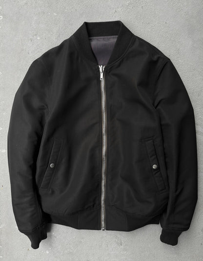Black bomber jacket on a gray background