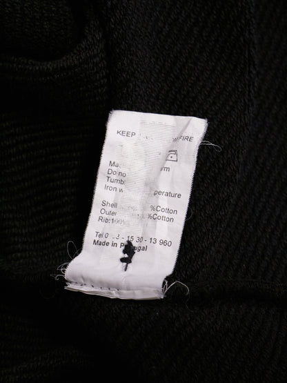 Textile label on a black fabric background