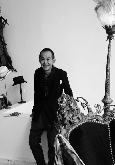 Hikaru Katano portrait in black and white — designer known for avant-garde clothing inspired by indigenous Japanese tradition