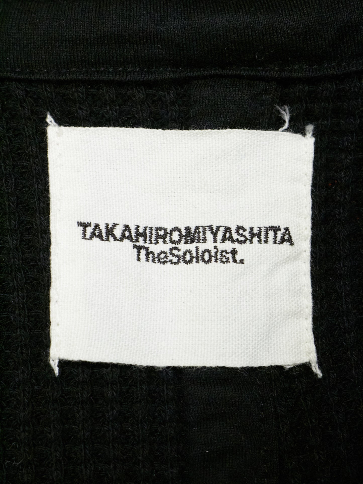 Label with 'TAKahiromiyashita TheSohoist' text on a black background