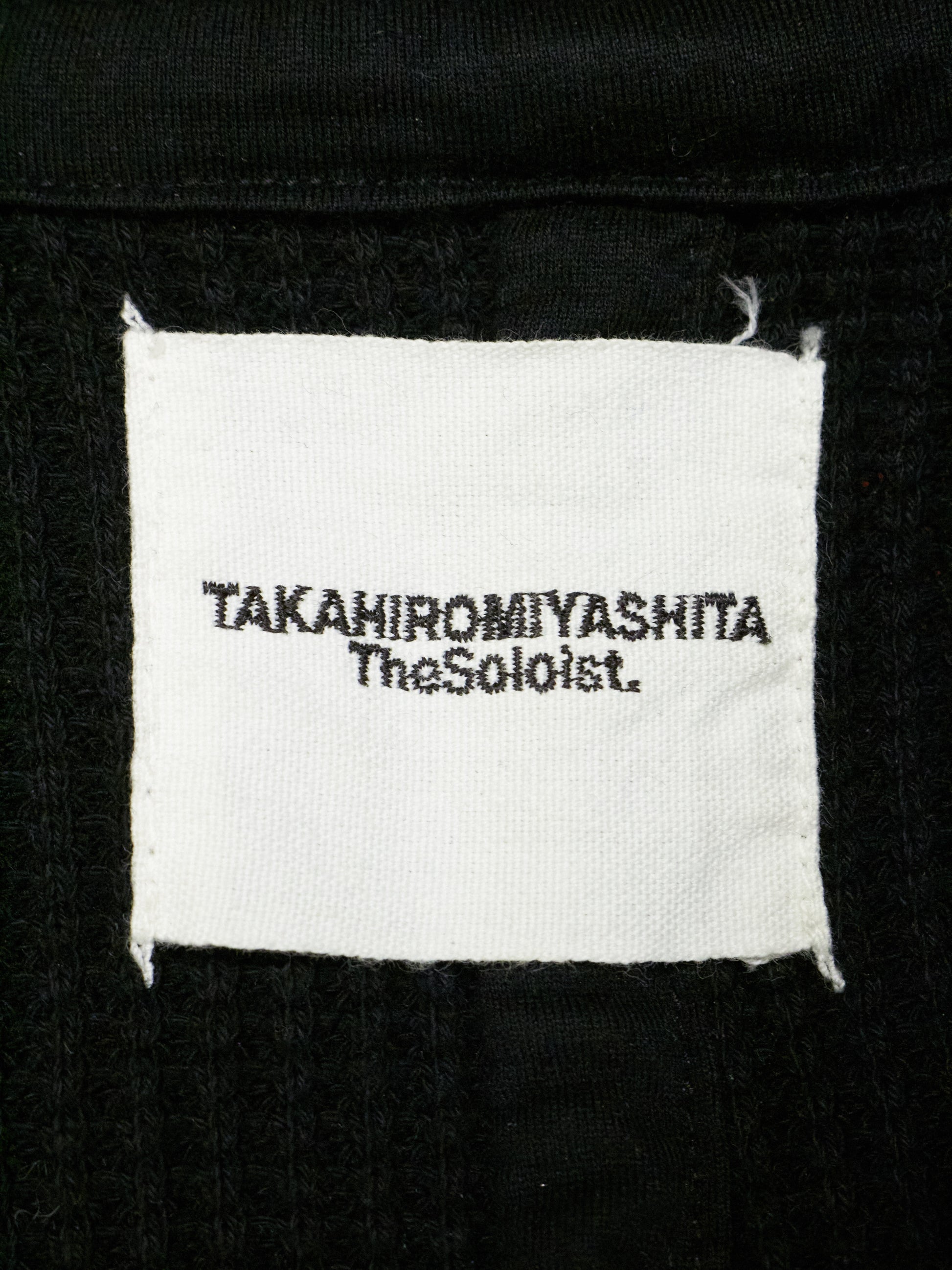 Label with 'TAKahiromiyashita TheSohoist' text on a black background