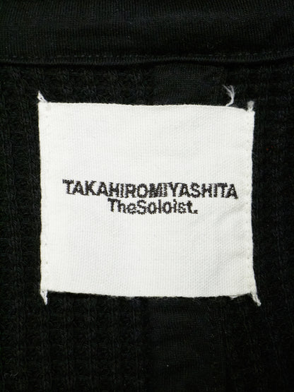 Label with 'TAKahiromiyashita TheSohoist' text on a black background