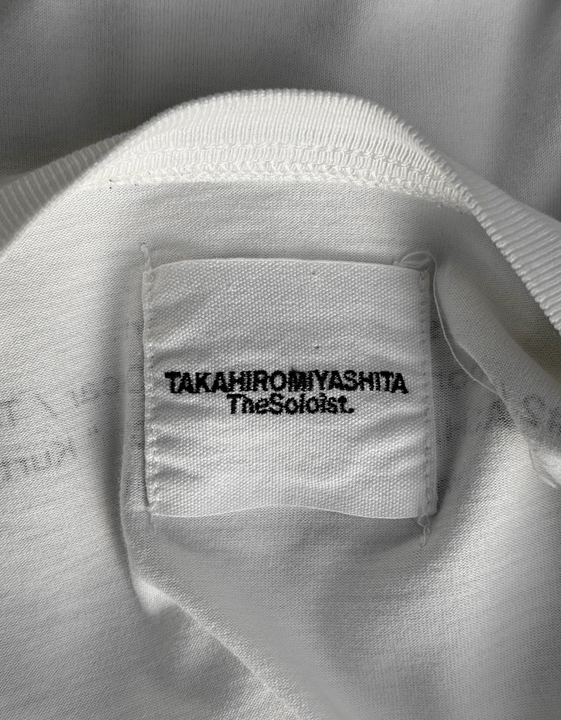 Close-up of a label on a white garment with text