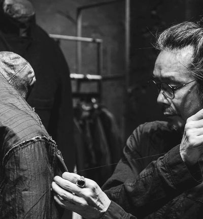 Tomoaki Okaniwa portrait in black and white — Japanese avant-garde clothing designer with military influence