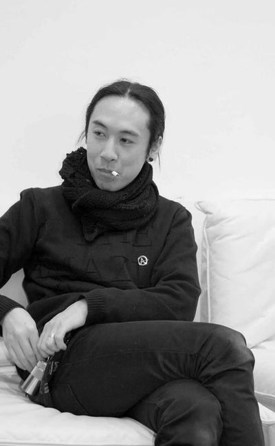 Jun Takahashi portrait in black and white — founder of UNDERCOVER, streetwear and avant-garde clothing label