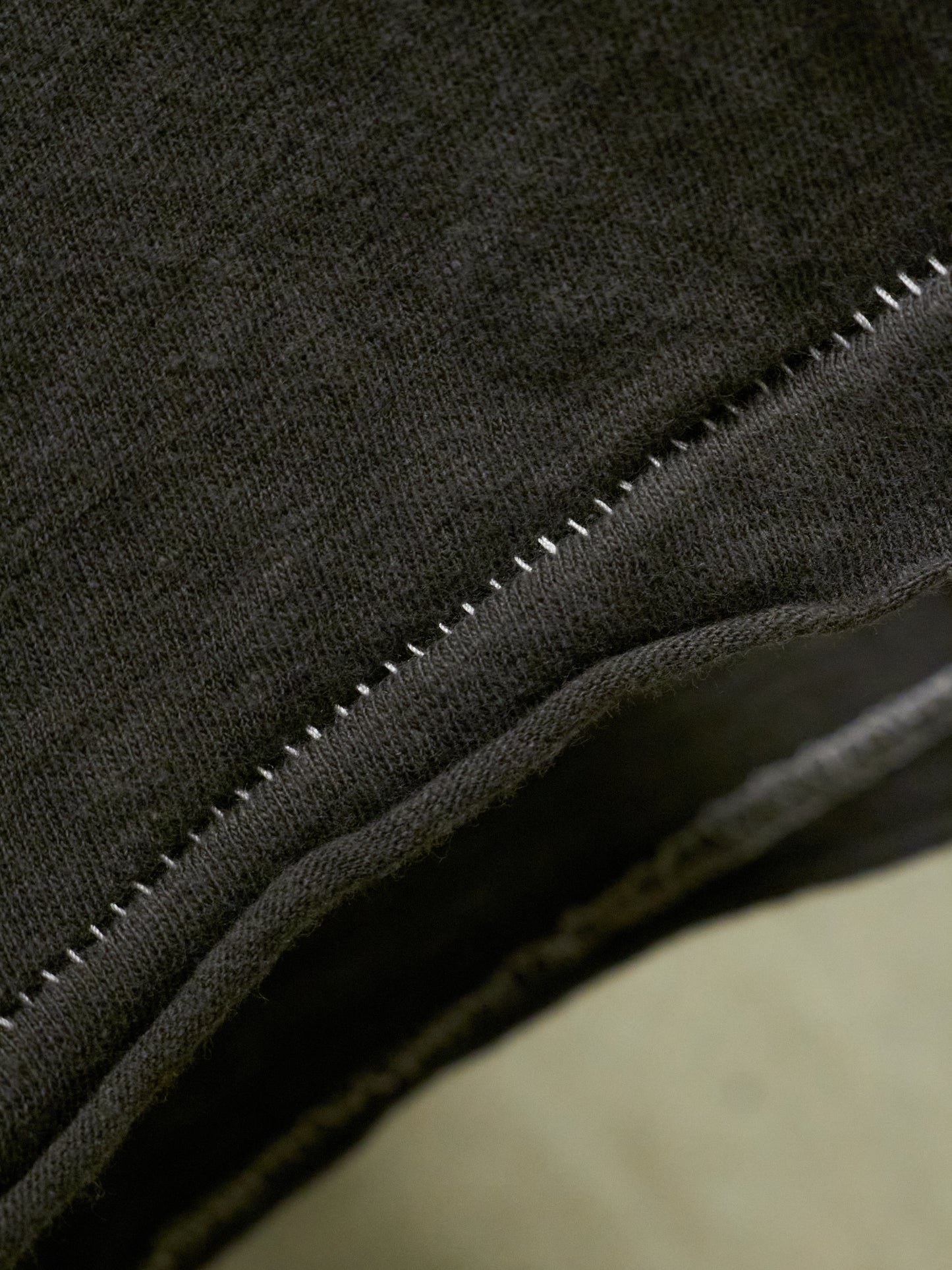 Close-up of a black fabric with stitching detail