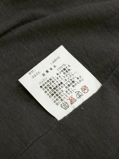 Clothing label on a dark fabric background