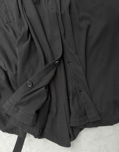 Black coat draped over a surface