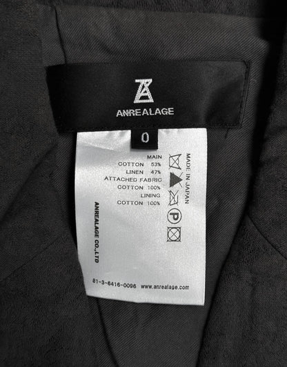 Label on a garment with 'Anrealage' branding and text details.