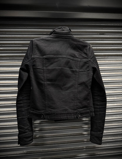 Black jacket on a metallic surface