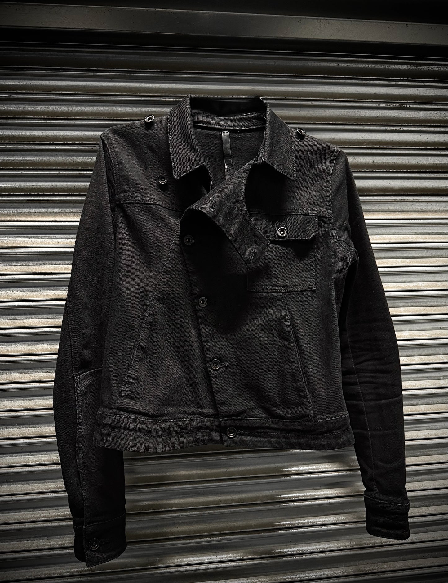 Black jacket on a metallic surface