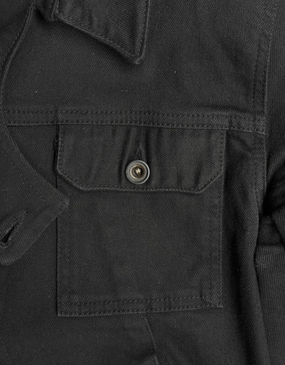 Close-up of a black jacket with a buttoned pocket