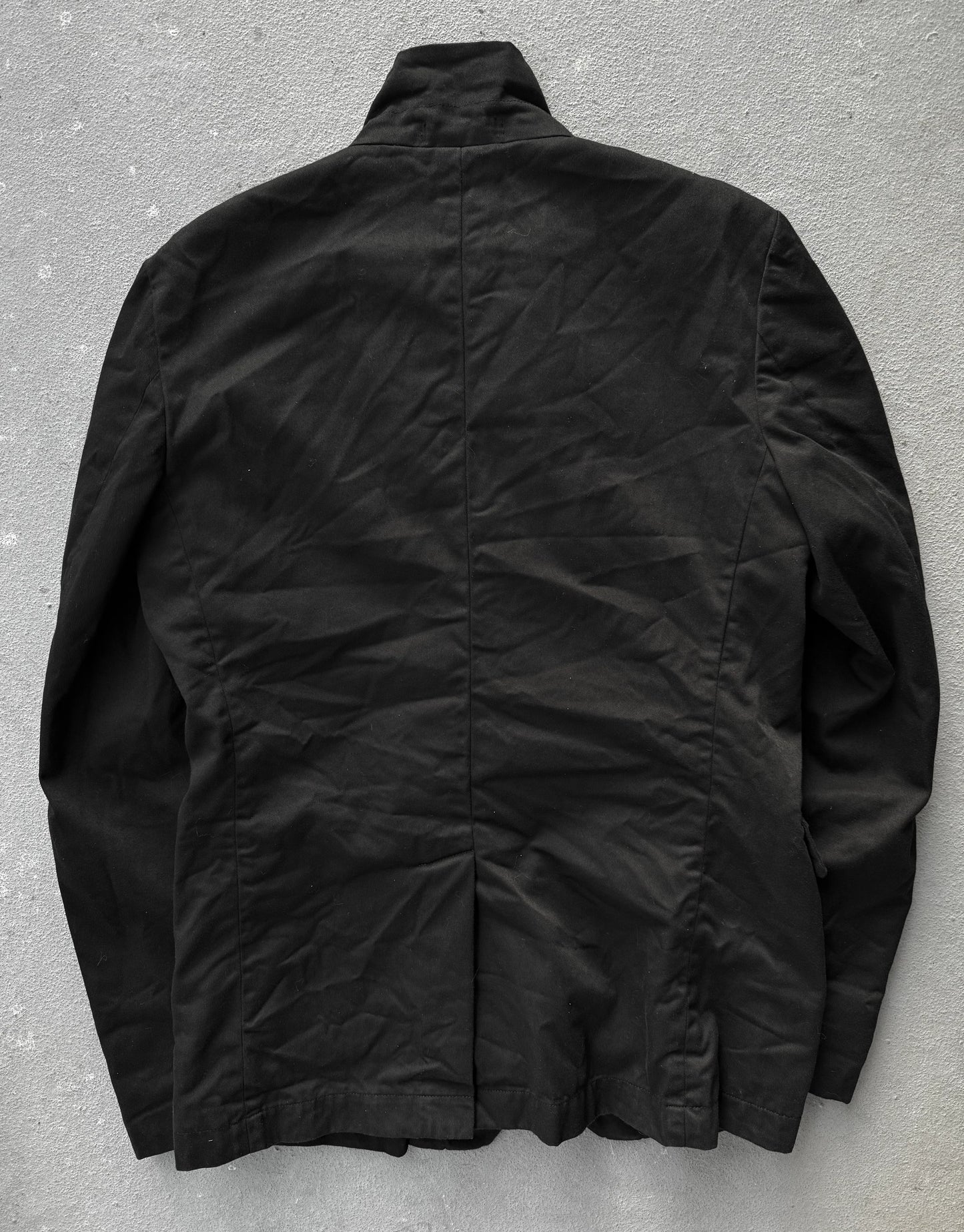 Black jacket on a gray textured background