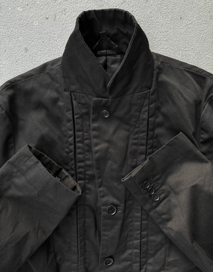 Close-up of a black jacket with a textured background