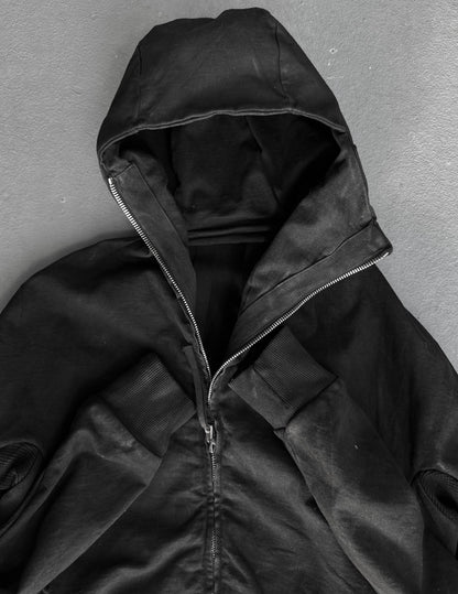Black hooded jacket on a gray background
