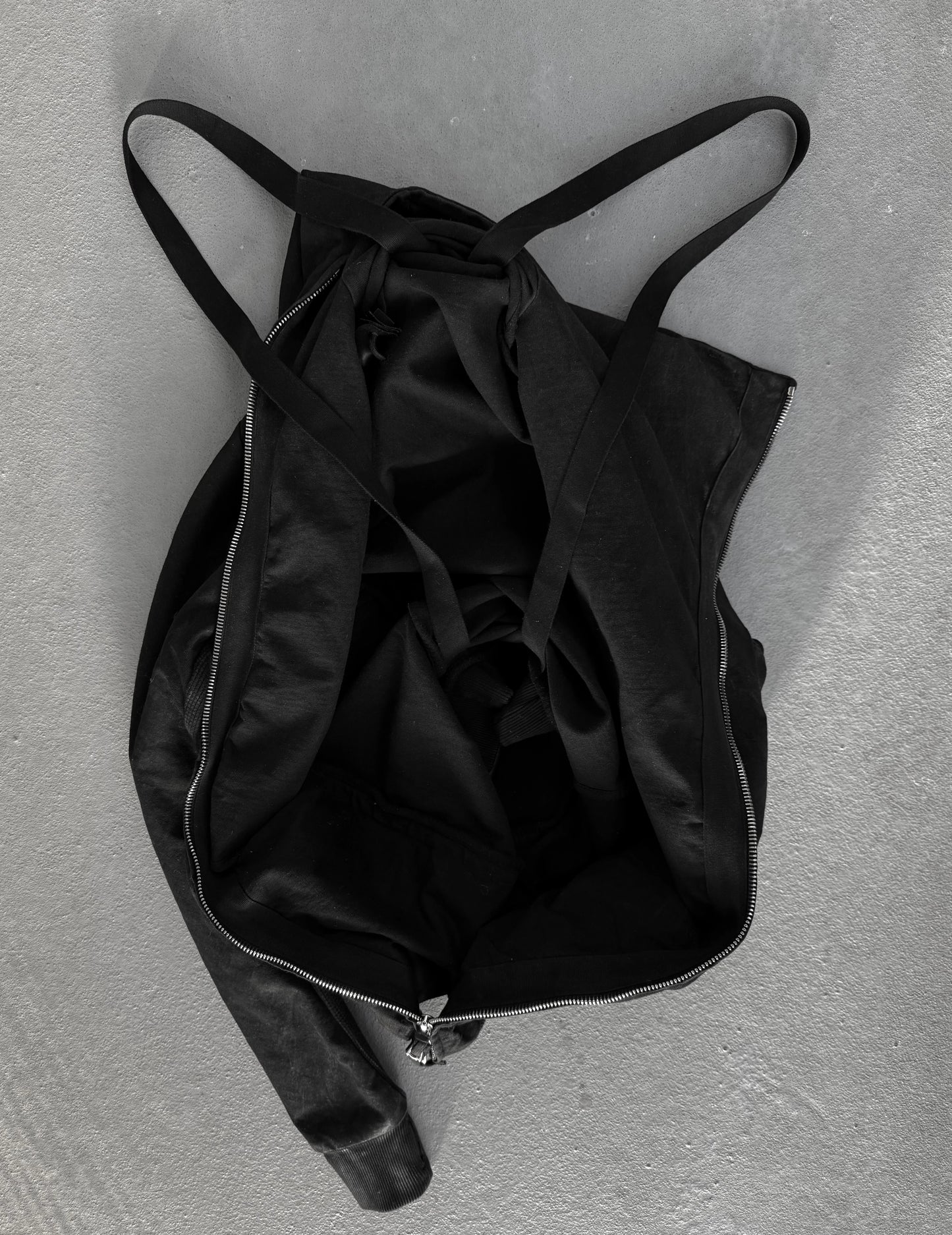 Black backpack on a gray background