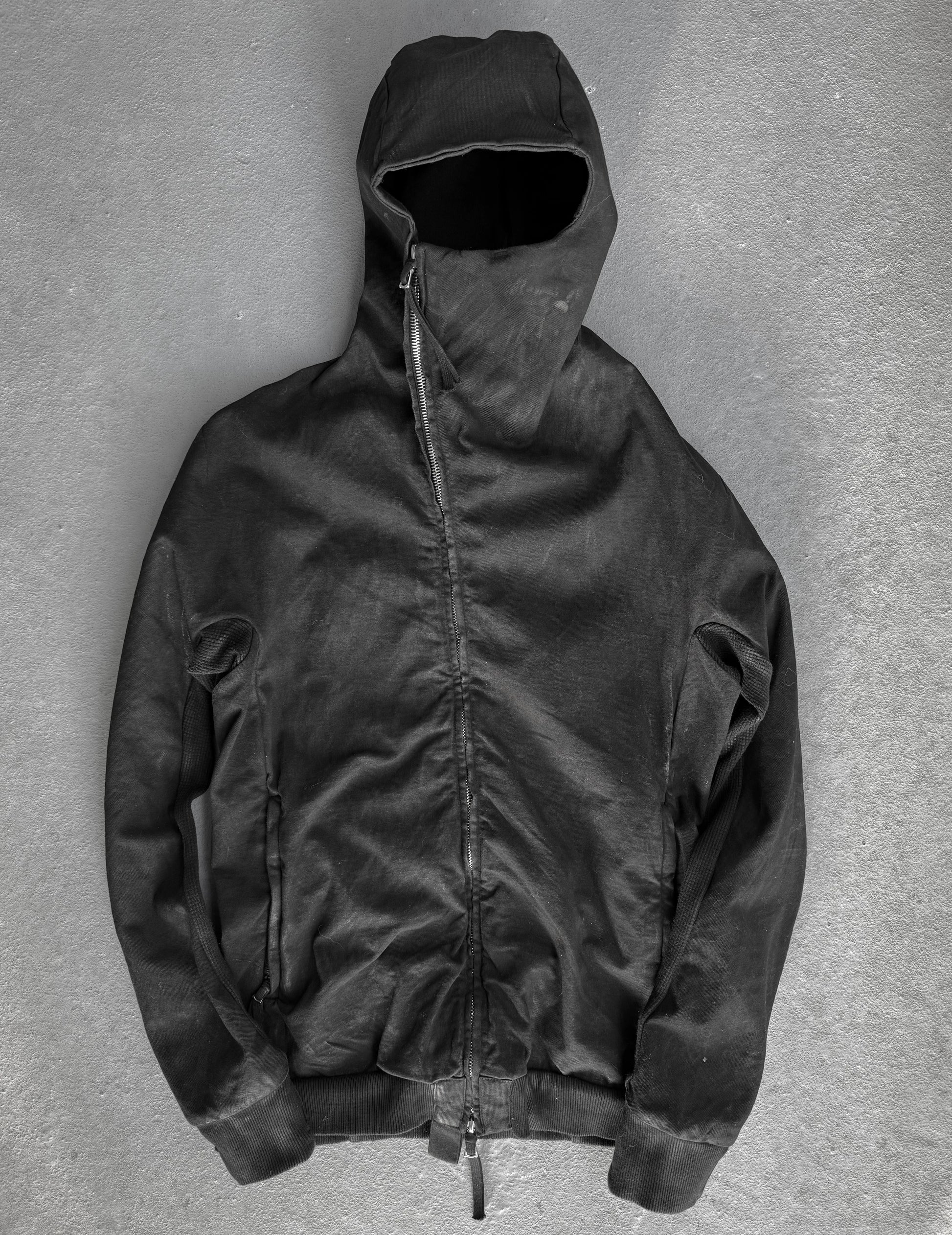 Black hooded jacket on a gray background