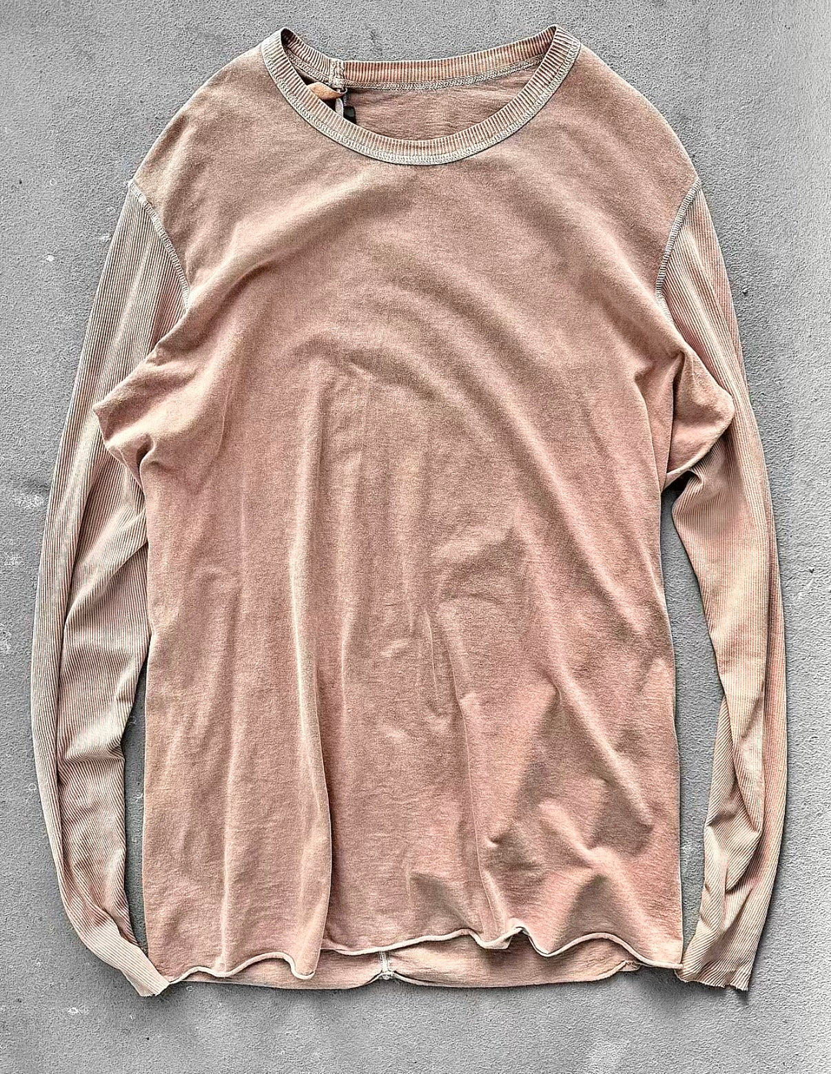 Beige long-sleeve shirt on a gray background