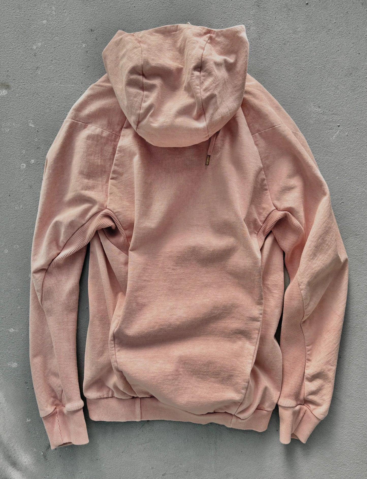 Pink hoodie on a gray background