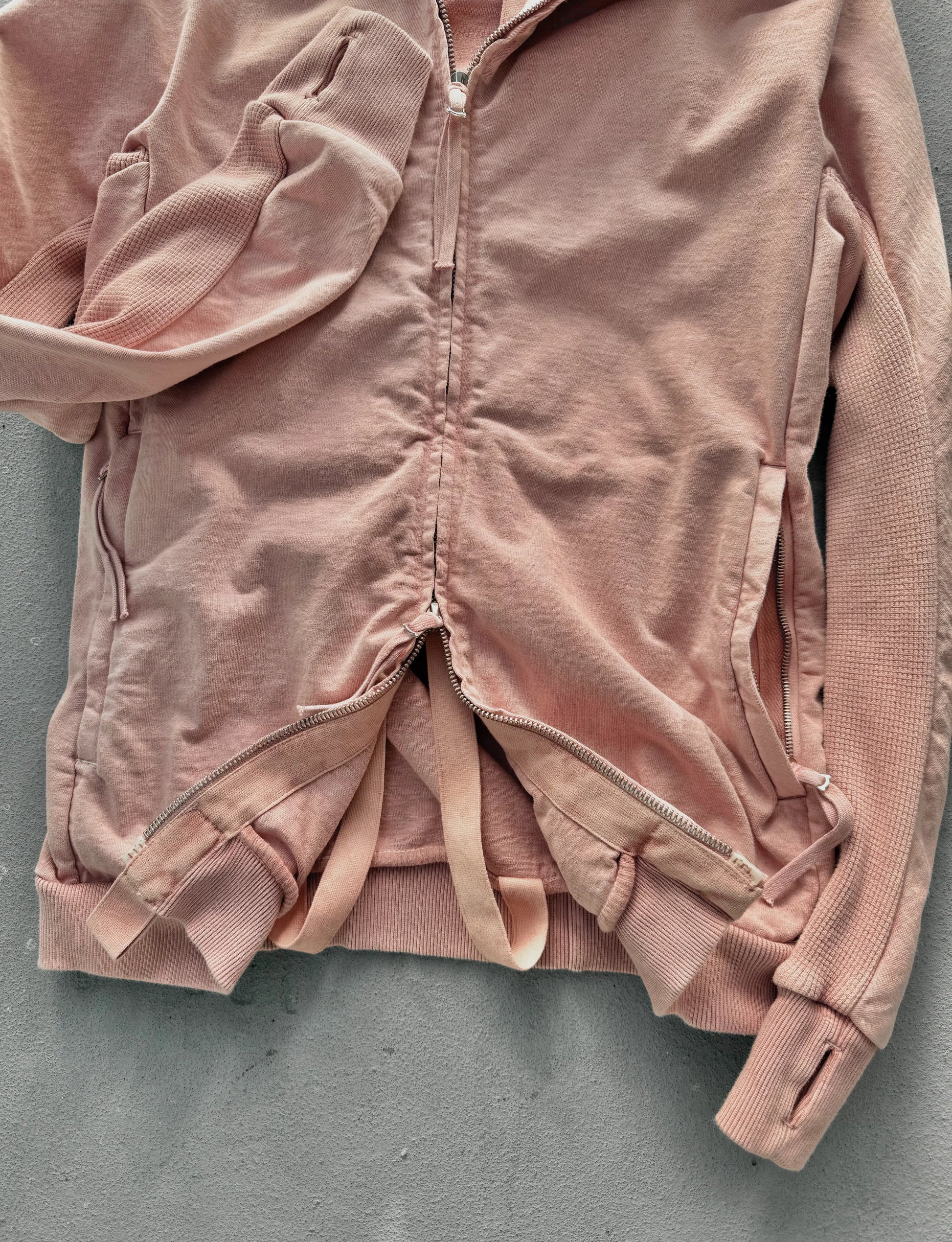 Pink jacket on a gray background