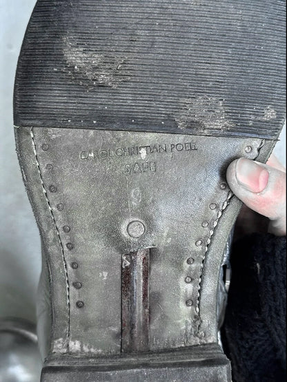 Close-up of a worn shoe sole with visible ‘CCP’ branding and wear.