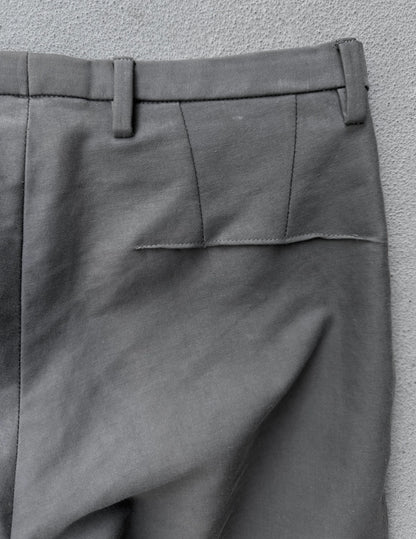 Gray pants with a pocket detail on a gray background