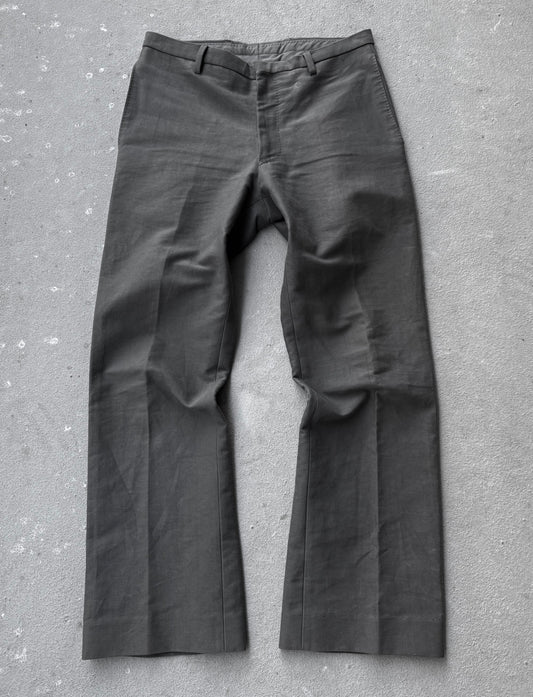 Dark gray pants on a textured gray surface