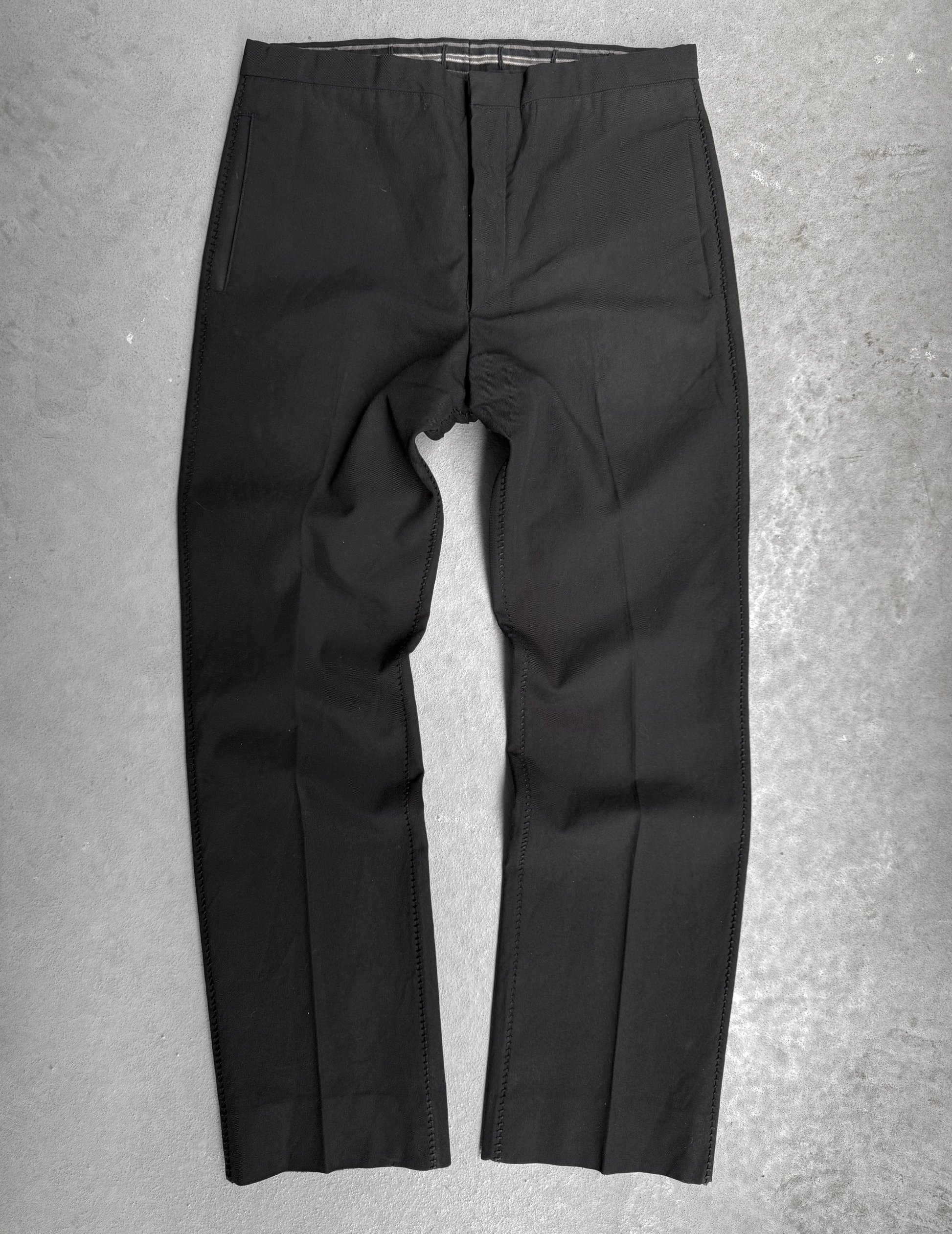 Black pants on a gray textured background
