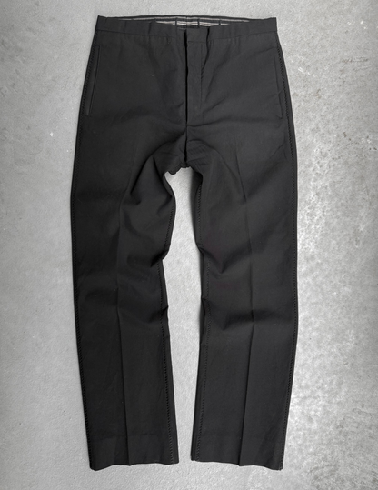 Black pants on a gray textured background