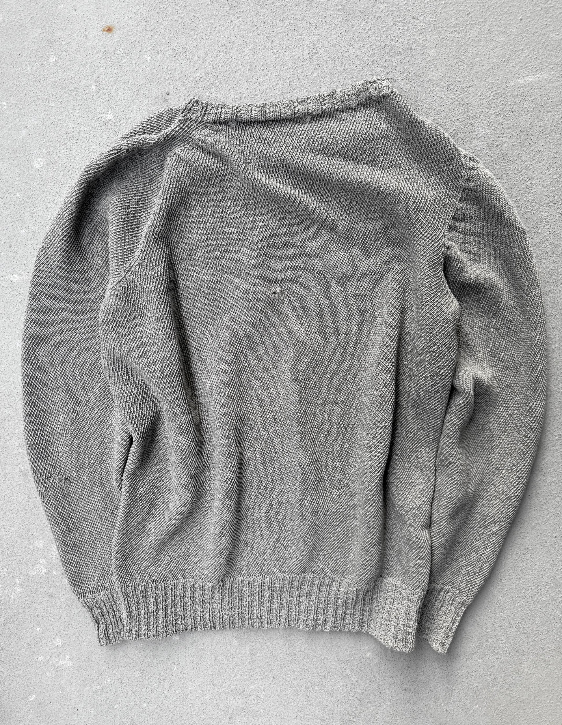 Gray sweater on a gray surface