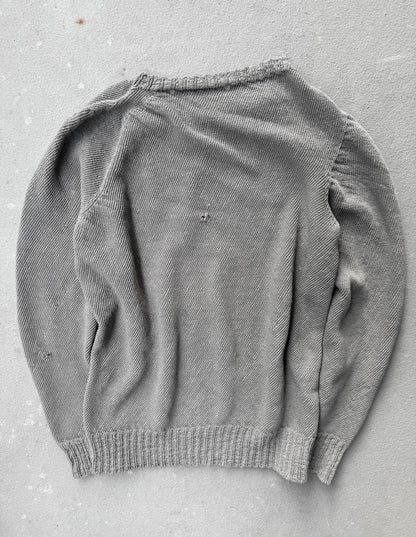 Gray sweater on a gray surface