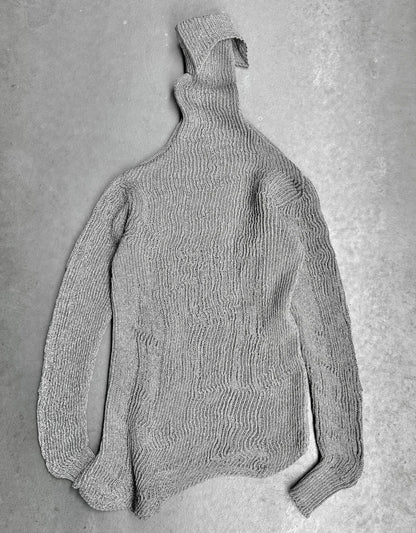 Gray knitted sweater on a gray background