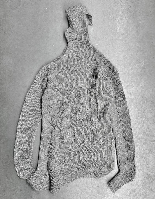Gray knitted sweater on a gray background