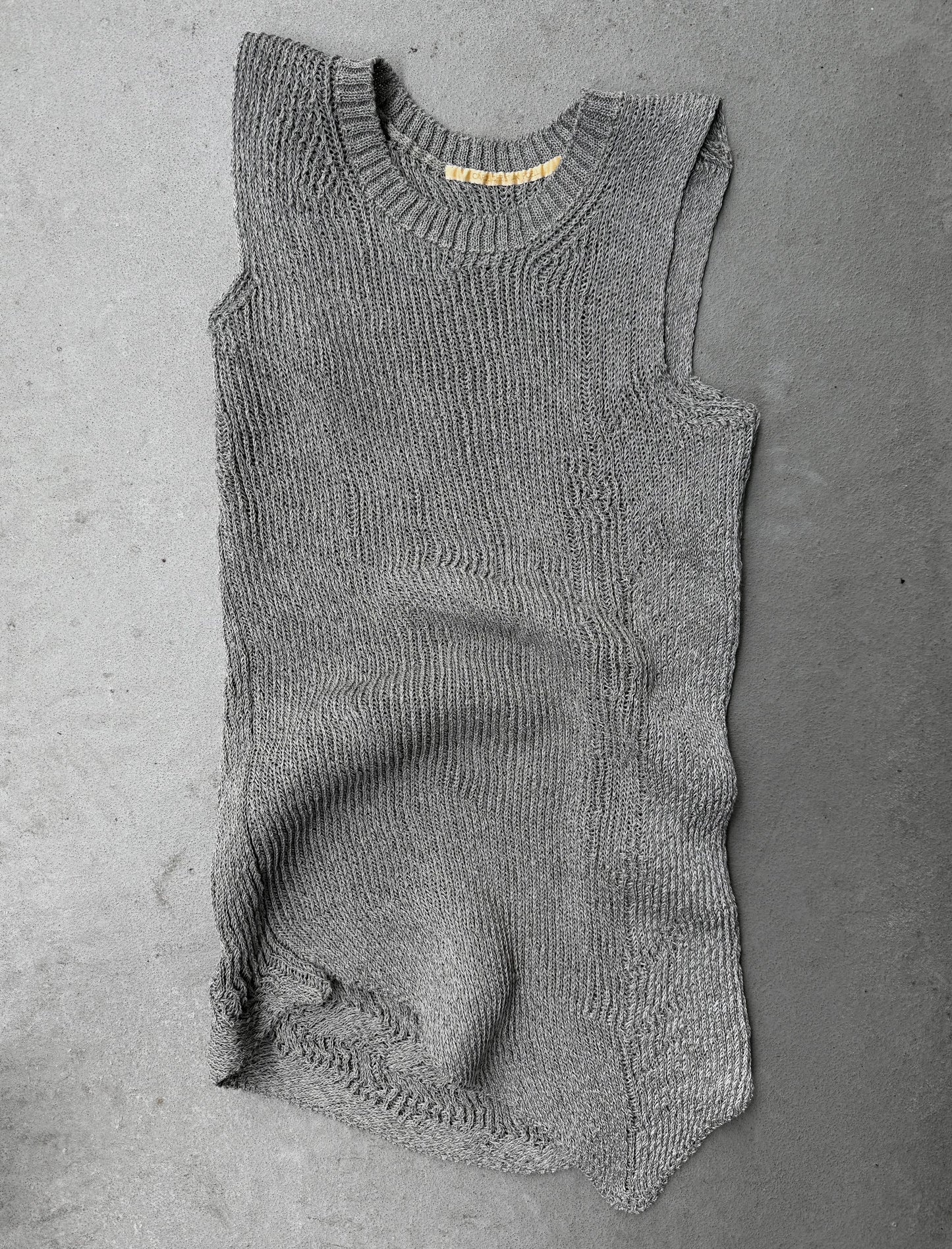 Gray knitted romper on a gray background