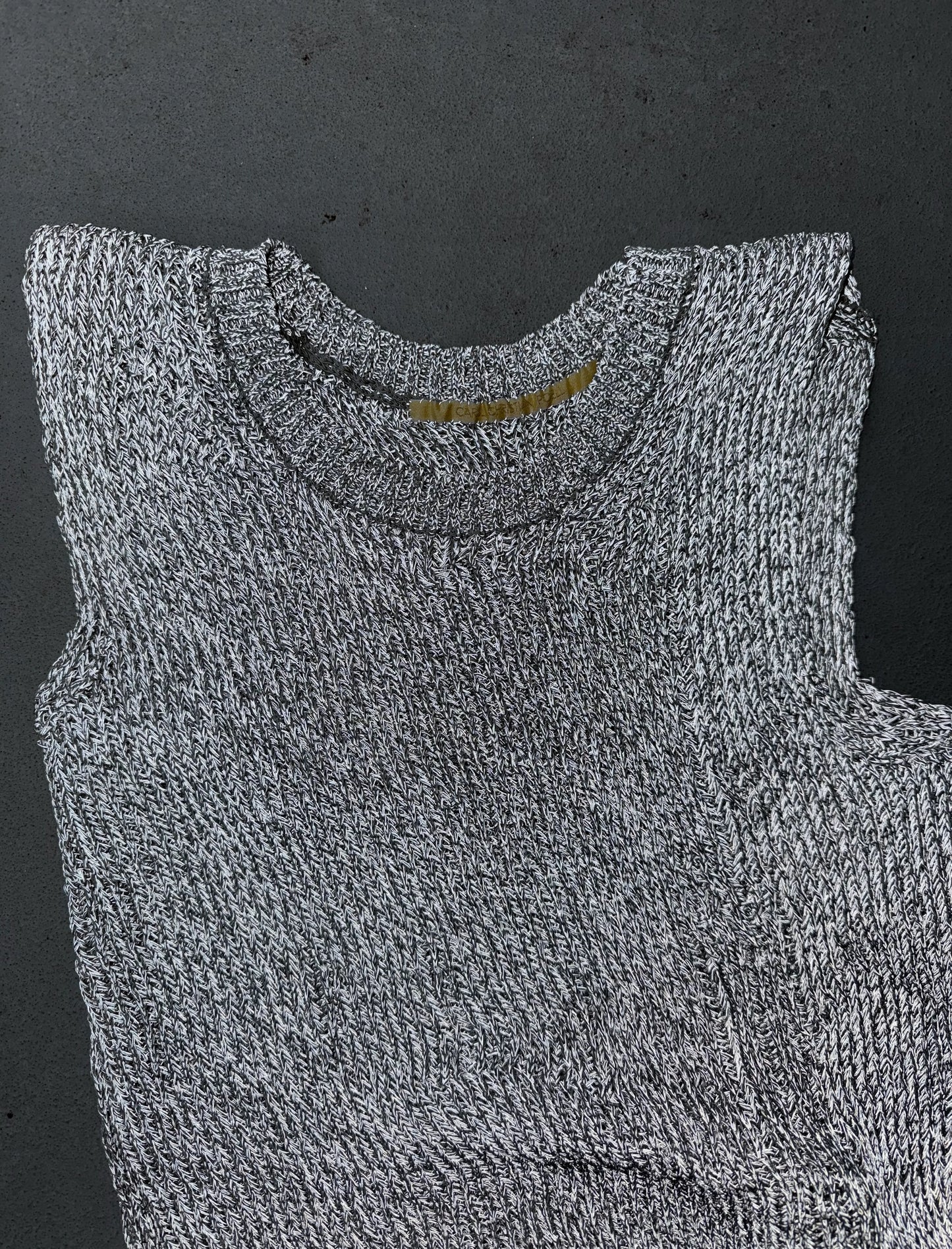 Gray carol sleeveless top on a dark background