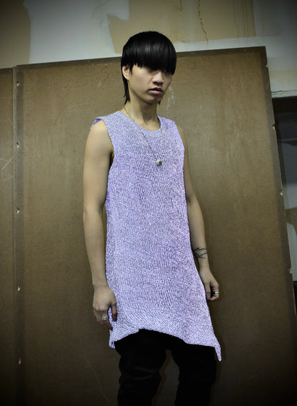 Person wearing a reflective Carol sleeveless knit standing against a plain background