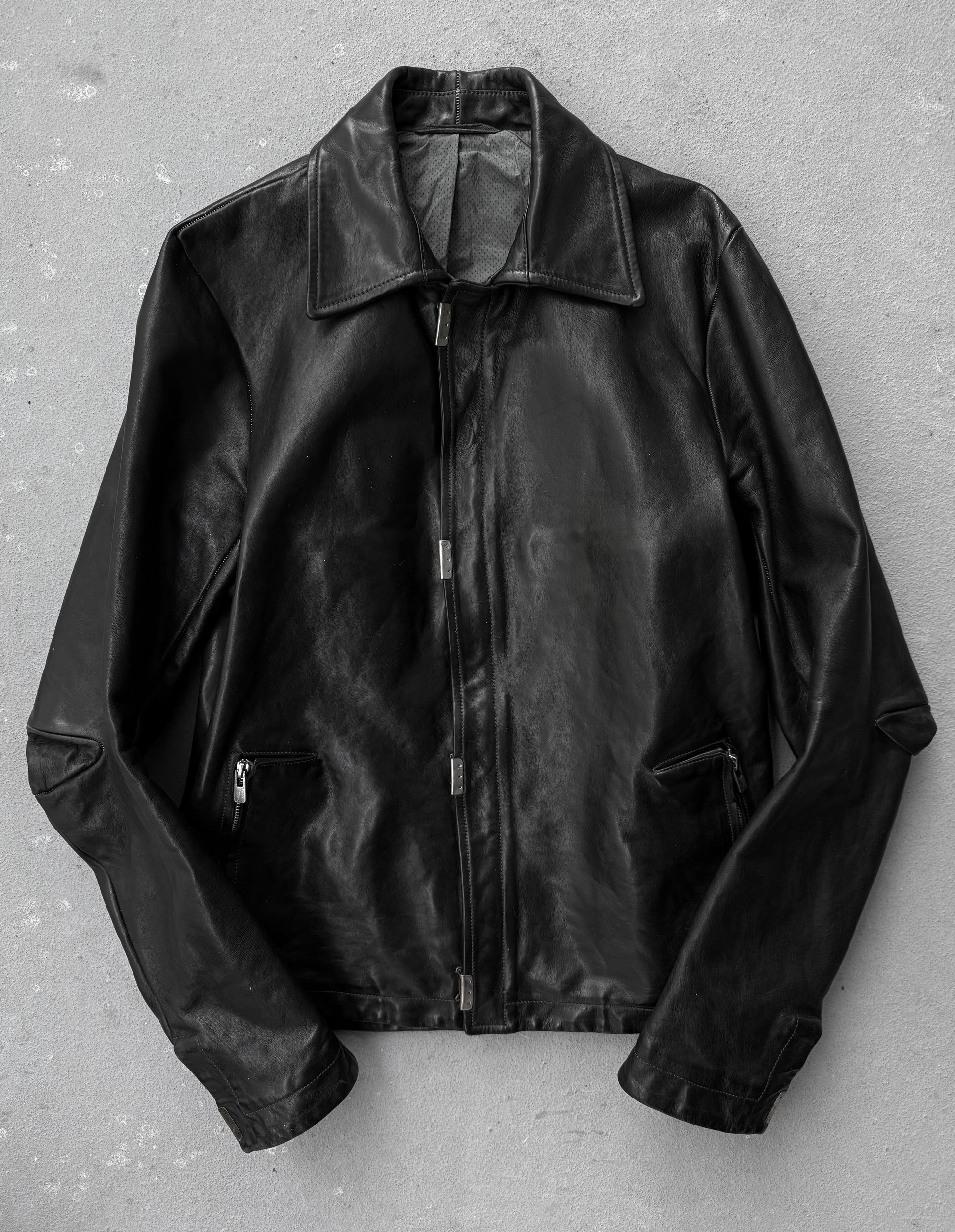 Black leather jacket on a gray background