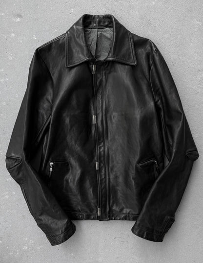 Black leather jacket on a gray background