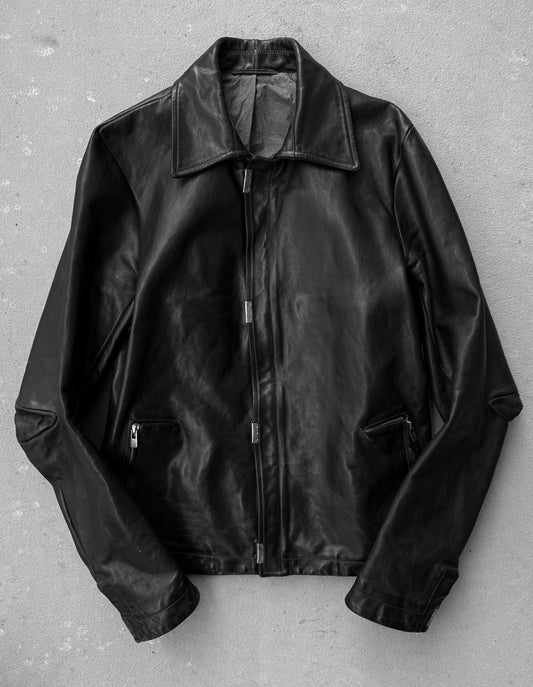Black leather jacket on a gray background